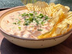 a bowl filled with chips and dip