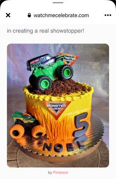 a birthday cake with monster trucks on top