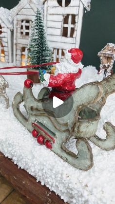 a sleigh with santa riding on it in the snow