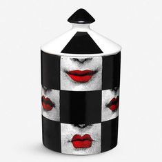 a black and white canister with red lips on the front, in an abstract checkerboard pattern