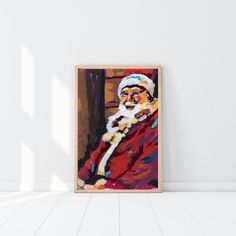 a painting of santa claus on a white wall