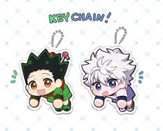 two key chains with the words key chain and an image of anime characters on them