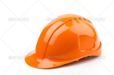 an orange hard hat on a white background - stock photo - images gratification