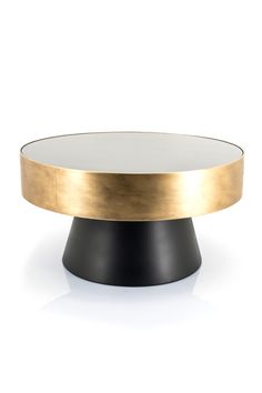 a black and gold coffee table with a white top on a white surface, viewed from the front