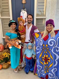 the family is dressed up as disney characters