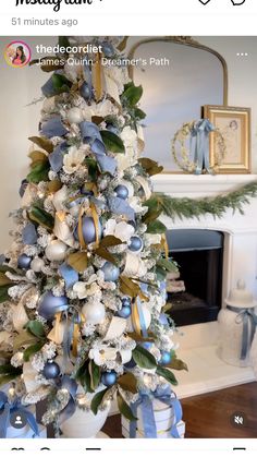 a decorated christmas tree with blue and white ornaments