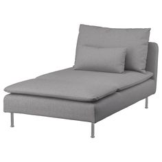 a gray chaise lounger sitting on top of a white floor