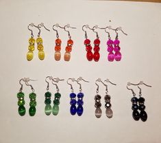 six pairs of earrings with different colored beads