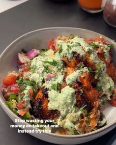 a white bowl filled with food on top of a table