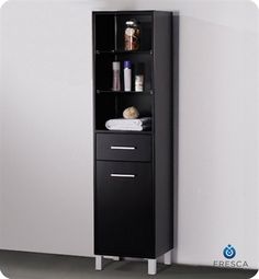 a tall black cabinet with drawers in the corner