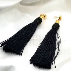 Black Tassel Earrings Are So On Trend And Very Stylish. Bohemian Or Black Tie Affair, These Earrings Won't Disappoint. Approx.* Length Is 4" Goldtone Posts Black Silky Tassels Wrapped Rope Design On Top With A Hint Of Gold Shimmer. Simple Styling Brand New And Comes In Original Packaging Black Tassel Drop Earrings, Black Fringe Tassel Drop Earrings, Black Drop Tassel Earrings As Gift, Black Fringe Drop Earrings, Black Tassel Jewelry For Party, Black Tassel Party Jewelry, Adjustable Elegant Tassel Earrings For Party, Black Fringe Dangle Earrings, Black Tassel Drop Earrings For Evening