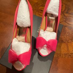 Beautiful New Pink/Coral Fabric/Satin Bow Platform Badgley Mischka Pump Heels! Never Worn! Heel Measures 4 3/4” & Platform Is 3/4”, So It Is A 4” Heel Rise. With Box & Extra Heel Caps. Box Written On. Perfect For Dressy Spring & Summer Events. Gorgeous Color! I Am An 8.5 M Shoe Size & These Fit Me. Brand New, But Tags Removed From Shoes. If You Would Like More Photos, Please Ask! I Can Remove The Cardboard & Paper From The Toe Area & Photograph, If You Would Like. They Have Never Been Worn.. Pink Heels For Spring Events, Spring Formal Heels With Pink Bow, Formal Spring Heels With Pink Bow, Orange Open Heel Heels With Padded Heel, Pink 4-inch Heels For Events, Pink High Heels With Bow, Spring Orange Heels With 4-inch Heel, Pink Mules With 4-inch Heel For Party, Pink Mules With 4-inch Open Heel