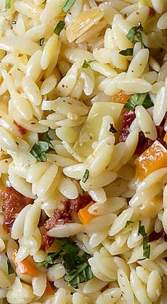 a close up view of some rice and vegetables