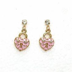 Betsey Johnson Pink Heart with Lock Rhinestone Earrings Item: Pierced Earrings Vendor: Betsey Johnson Earring Dimensions: .71" x .47" (Inches) Color: Pink, Gold Metal: Alloy Material: Enamel, Rhinestones Theme: Heart, Love, Lock All Measurements Are Approximate. Sold As One Pair Of Earrings Fun brooches, pendants, earrings, flirty necklaces, and chunky bracelets do more than just add a touch of sparkle – they represent who you are. Betsey Johnson Jewelry does this beautifully with a complete lin Cutest Jewelry, Betsey Johnson Earrings, Love Lock, Animal Prints Pattern, Chunky Bracelets, Betsey Johnson Jewelry, Valentines Jewelry, Heart Love, Sparkling Crystal