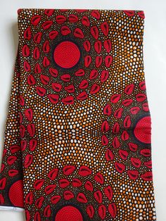 Red and brown African fabric by the yard, 100% cotton African material, geometric Africa wax print ankara fabric Trending print African print ! African wax print fabric Beautiful traditional African design with vibrant colors.   Red and brown African fabric by the Yard  African Textile  African Supplies for dress skirt headtie cotton african material pagne Sold by yard. High quality, 100% cotton African print fabric. 46" inch wide. cotton. PayPal & Credit cards are accepted. If you order more than one yard, you will receive a single continuous fabric.  Thank you for visiting our shop. Colors may slightly vary from your monitor display. Ankara Fabric With Geometric Pattern Prints, Ankara Fabric With Unique Pattern Prints, Colorful Patterned Red Ankara Fabric, Brown Ankara Fabric With Batik Print, Ankara Fabric With Abstract Pattern, African Material, African Wax Print Fabric, African Textile, Wax Print Fabric