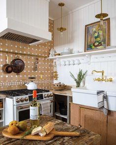 a kitchen with an oven, stove and counter top