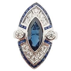 Blue Sapphire 2.62 carats with Diamond 0.49 carat and Blue Sapphire 1.30 carats Ring set in 18 Karat White Gold Settings Width: 1.5 cm Length: 1.7 cm Ring Size: 55 Total Weight: 10.72 grams "We first opened doors in 1980 when it was then situated in the vicinity of the Victory Monument; a small and modest storefront with a couple of counters. From its humble beginnings to where it stands today, our company has proven its abilities as a jeweler. Since the beginning, we have been supplying fine qu Luxury Blue Marquise Cut Jewelry, Luxury Blue Marquise Rings, Blue Art Deco Diamond Ring With Diamond Cut, Luxury Sapphire Marquise Rings, Luxury Marquise Cut Sapphire Ring, Luxury Blue Marquise Jewelry, Blue Multi-stone Sapphire Ring In Art Deco Style, Luxury Marquise Sapphire Ring In White Gold, Classic Blue Marquise Diamond Ring