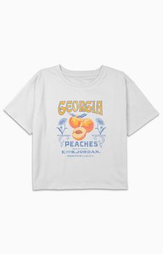 Online only! The Kids Georgia Peaches T-Shirt showcases a sweet and playful design inspired by Georgia's famous peaches. With a crew neckline, short sleeves, and a comfortable fit, it's a delightful choice for young ones to show their love for this iconic fruit and state.


	Solid color tee
	Short sleeves
	Crew neckline
	Front graphic
	Regular fit
	60% Cotton, 40% Polyester
	Machine washable Cute Peach T-shirt With Graphic Print, Heather Peach Graphic Print T-shirt For Summer, Heather Peach T-shirt With Graphic Print For Summer, Heather Peach Graphic Print Crew Neck T-shirt, Peach Graphic Print Short Sleeve Top, Peach Short Sleeve Top With Graphic Print, Heather Peach Short Sleeve Graphic Tee, Cute Peach Crew Neck T-shirt, Cute Peach T-shirt With Letter Print