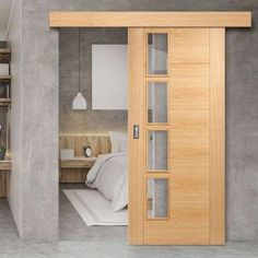 an open door leading to a bedroom with a bed and desk in the corner next to it