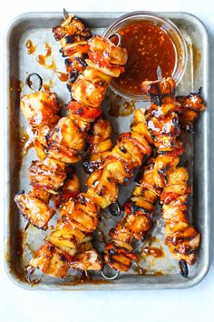 chicken skewers with bbq sauce on a tray