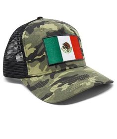 a camo hat with the flag of mexico on it