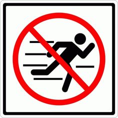 a no running sign is shown in black and white with a red circle behind it