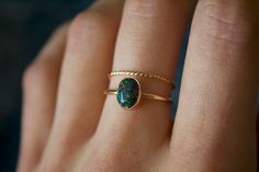 Handmade 8x6mm oval black opal ring✨  * Listing covers both the opal ring and twisted band. Dainty and perfect minimalist piece!  Stunning 8x6mm lab grown Kyocera opal gemstones. Each stone is hand set into a bezel and polished for a beautiful shine finish.   Opal means jewel. The energies of this stone will also encourage you to express your true self, in addition to feeling confident and comfortable in your own skin, and this will radiate in your words, thoughts, and actions. * Please note photos are zoomed in up close, therefore the size of the stone may appear slightly larger in photos. Model is wearing a size US 5.5. Please refer to stone measurement to best determine the size & look you're looking for.  Material: 14/20 (karat/purity) gold filled metal OR 925 Sterling silver / 935 arg Black Oval Opal Jewelry, Oval Black Opal Jewelry, Dainty Handmade Oval Opal Ring, Black Opal Jewelry, Black Opal Ring, Opal Ring Gold, Feeling Confident, Twisted Band, Argentium Silver