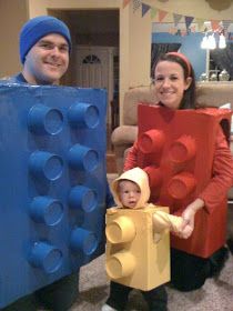 two adults and a child are dressed up as lego characters