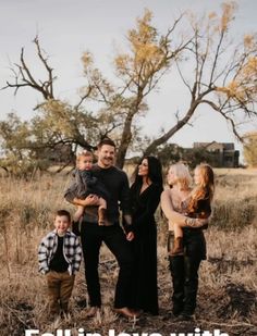 a family standing in the middle of a field