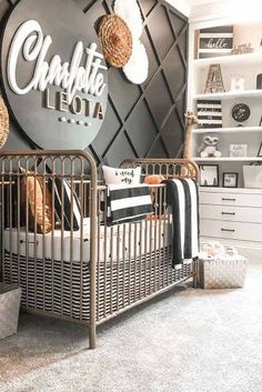 a baby's room with black and white decor