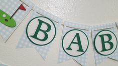 baby shower banner with green and white letters