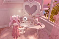 a room with pink furniture and decorations in the shape of a heart on top of a table