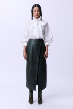 Fall '24: Allow Our Latest Collection Of Autumn Pieces To Inspire You For The Season Ahead. Experience Updated Essentials With Our Midi Skirt, With A Fitted Silhouette And A High Waistline, Creating A Universally Flattering Fit. The Sleek, Leather Fabric Makes For An Edgy Yet Versatile Piece, And This Piece Can Easily Be Paired With A Crop Top For A Day To Night Look, Then With A Blouse For A More Formal Approach. Leather Double Waistband A-Line Midi Skirt High Quality Leather Fabric Comfortable High Waistline Flattering A Line Silhouette Thigh High Leg Split Accent Double Belt Accent At Waist Midi Length Green A-line Pleated Lined Skirt, Chic Midi-length Belted Skirt, Leather Lined Midi Skirt, Knee-length Leather Skirt, Leather Knee-length Lined Skirt, Petite Wedding Guest Dresses, Plus Size Formal, Petite Coat, Skirt Leather