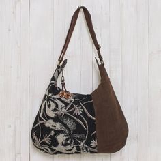 From Thai designer Sansanee Krasae this eye-catching cotton handbag features a floral print inset. In tones of silver deep black and rich brown it opens to reveal a zipper pocket and two open compartments. The zipper pull is adorned with a leather flower. Cheap Bohemian Brown Shoulder Bag, Cheap Bohemian Brown Bags, Cheap Vintage Bags For Fall, Hobo Purses And Handbags, Affordable Vintage Bags For Fall, Affordable Vintage Women's Bags, Fair Trade Gifts, Hobo International Handbags Vintage, Black Rectangular Canvas Hobo Bag