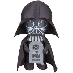 a darth vader plush toy with a sign on it