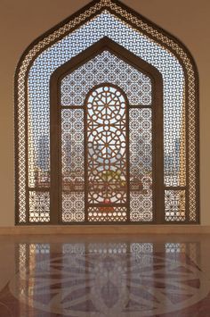 an ornate window in the middle of a building