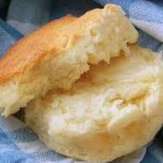 two pieces of bread sitting on top of a blue and white towel