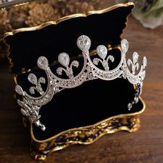 a tiara sitting on top of a wooden table