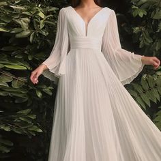 Plus Size White Wedding Dress With V Neckline, Long Bell Sleeve, Long Floor Length Gown With Semi Open Back. Sizes 1x, 2x, 3x, 4x. Please Note.. Shipping Is Approximately 2 Weeks For This Dress... No Cancellations. Please Message Before Ordering To Check Availability Size Us Bust Waist Hips Height 1xl 14 42.2-44.5 36.2-38.6 46.1-48.5 5'5"-5'7" 2xl 16 44.5-46.9 38.6-41.0 48.5-50.8 5'7"-5'9" 3xl 18 46.9-49.3 41.0-43.3 50.8-53.2 5'9"-5'11" 4xl 20 49.3-51.6 43.3-45.7 53.2-55.6 5'9"-5'11" Measurements Are All The Way Around The Body . Tags Church Ceremony Wedding Gowns, Bridal Gowns, Wedding Dress, Beach Destination, Vow Renewal , Elope Dress Banquet, Maxi Prom Dress, Elegant Bridesmaid Dresses, Banquet Dresses, Plus Size Bridesmaid, Bridesmaid Dresses Plus Size, Maxi Dress Prom, Bridesmaid Gown, Plus Size Wedding