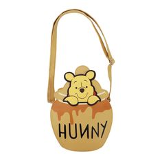 Step into the whimsical world of the Hundred Acre Wood with this Winnie The Pooh crossbody bag, crafted in the shape of a delightful Hunny Pot with Pooh peeking out. Made from durable PU materials, it features a spacious main zipper compartment, offering both practicality and nostalgic charm. Easily wipeable for effortless maintenance, this bag measures 10" W x 8.1" H x 2.6" D, ensuring ample space for essentials while maintaining a compact size. Novelty Purses, Disney Purse, Cute Winnie The Pooh, Small Crossbody Purse, Disney Bag, Bee Charms, Crossbody Messenger Bag, Small Crossbody, Disney Winnie The Pooh