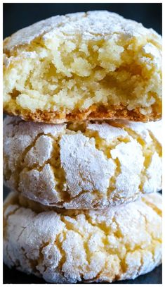 three cookies stacked on top of each other with powdered sugar and crumbs