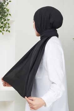 Discover the perfect blend of comfort and style with our Cotton Jazz Hijab, crafted from premium cotton jazz material. This hijab is incredibly soft and breathable, ensuring all-day comfort while being gentle on your skin. Its lightweight fabric allows for easy draping, making it super easy to style for any look, whether you're going for a casual day out or a more polished appearance. The wrinkle-free design means you can enjoy a fresh, flawless look without the need for constant ironing. Available in a range of beautiful colors, this hijab is a versatile accessory that complements any outfit. Embrace effortless elegance and comfort with our Cotton Jazz Hijab today! Size: 70 cm x 195 cm (approx) Casual Cotton Hijab, Black Cotton Headscarf, Shawl Black, Black Hijab, Effortless Elegance, Head Covering, Wrinkle Free, Shawls And Wraps, Lightweight Fabric