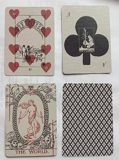 four playing cards with different designs on them