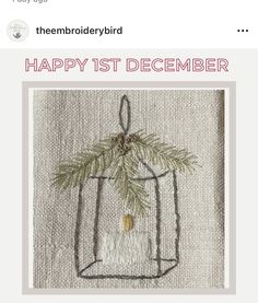 the embroidery bird happy 1st december card with a small tree in a bag on it