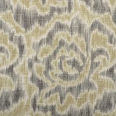 an upholstered fabric with grey and yellow flowers