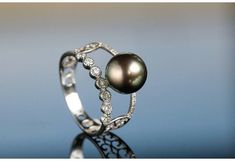 •Condition: Brand new•Center Stone: 5A+ Tahitian Pearls 9mm (Optional)•Side stones: Natural White Diamond round-cut(VS1 clarity and F color)•Metal Purity: Optional•superior pearls standard - 99% of the pearl surface is clean. An extremely detailed and up-close study of the pearl is needed to find imperfections.The item will be gift wrapped and shipped.---------------------------------------------------------Available in :14k Rose or Yellow Gold, White Gold18k Rose or Yellow Gold, White Goldand P Luxury Tahitian Pearl Wedding Rings, Tahitian Pearl Ring, Luxury Jewelry Box, White Diamond Ring, Pearl Collection, Ring Ideas, Tahitian Pearls, Conflict Free Diamonds, Tahiti