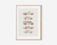 an art print with three cars in different sizes and colors, on a white wall