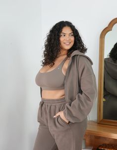 CozyCloud Jacket Feel your best in our new midweight CozyCloud Jacket, made to perfection. This bomber length jacket comes with a drawstring waistband so you can wear it full or adjust it to your desired length. Made with large kangaroo pockets. Completed with an oversized hoodie and beautiful gunmetal hardware. Made from our TeddyPlush fabric to keep you bundled up feeling like you're embraced by a cozy cloud. Perfectly paired with our CozyCloud Joggers or Effortless Leggings - Driftwood Featur Brushed Bronze Hardware, Love Fitness Apparel, Gunmetal Hardware, Love Fitness, Brushed Bronze, Oversized Hoodie, Drawstring Hoodie, Oversize Hoodie, Drawstring Waistband