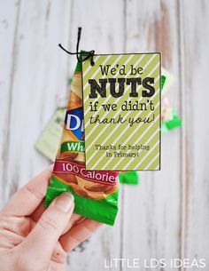 a person holding up a candy bar with the words we'd be nuts if we didn't thank you