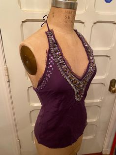 Silk, polyester, and Rayon, dark purple beautiful halter tank top from the 80's. Fairly heavy from the beading, nice weight! Beautiful beaded design around neck line. Perfect for a night out or a sunny day!  Size: M length: 21" waist: 29" bust: (adjustable) roughly 36" Dark Purple Top, 80s Tank Top, Beaded Halter Top, Ideas For Ocs, Halter Tank Top, Halter Tank, Sherman Oaks, Womens Tank Tops, Purple Top